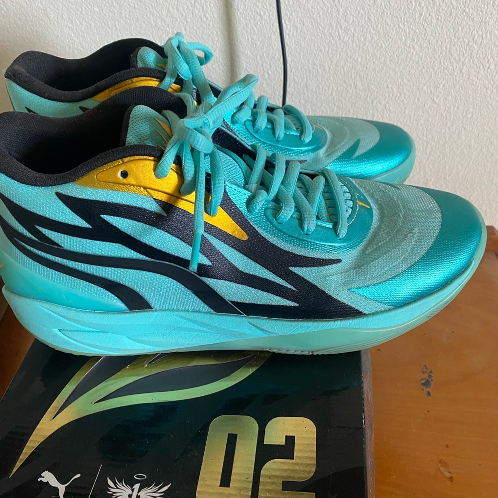 Puma Turquoise and Black Sneakers with Gold Detail